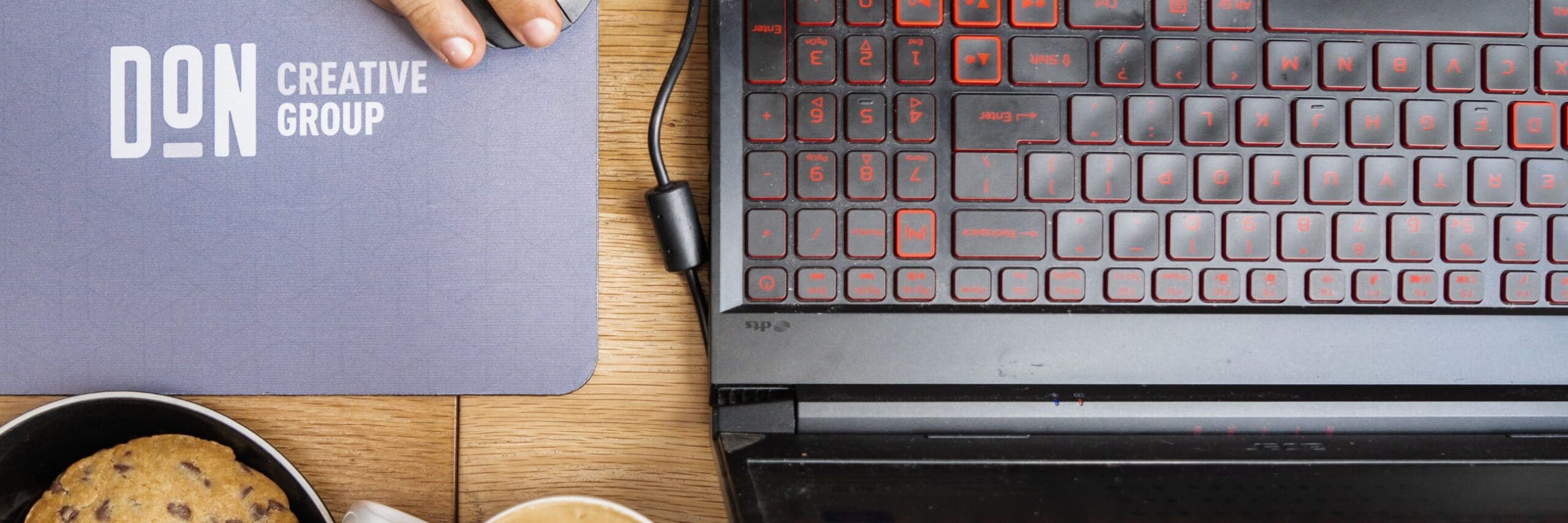 A website developer working on a website while eatingg cookies and having coffee, Website Development