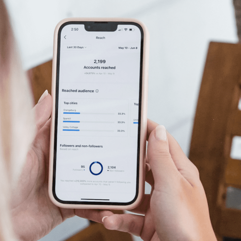 Kennedi looking at the metrics of a client after they hired Don Creative to run their social media