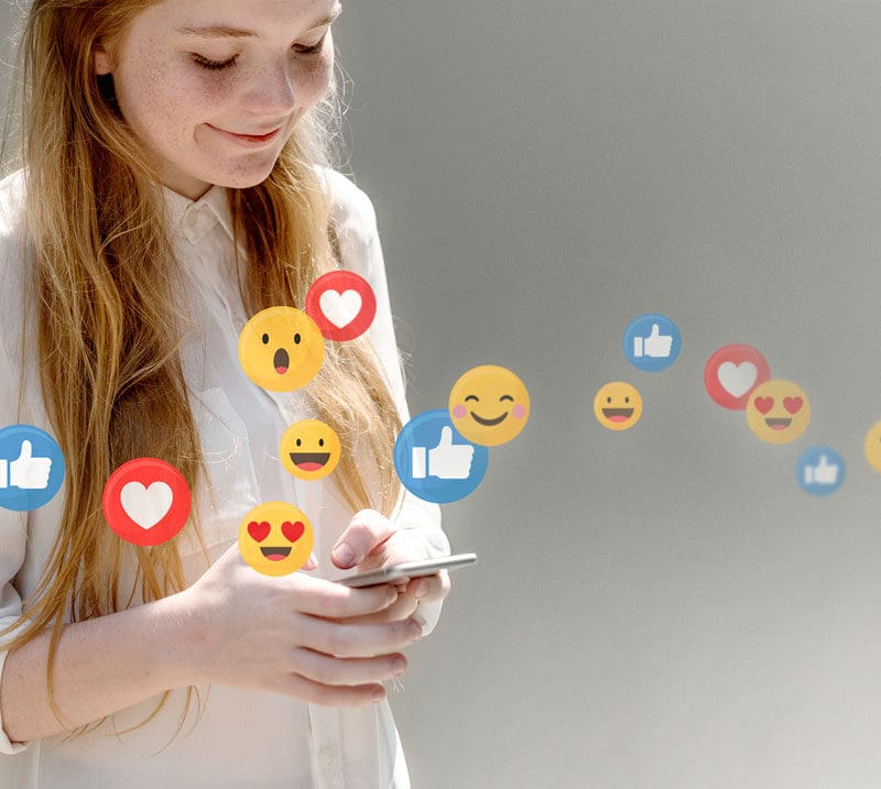 User engaging with social media content on a smartphone with likes and reactions representing social media marketing strategy