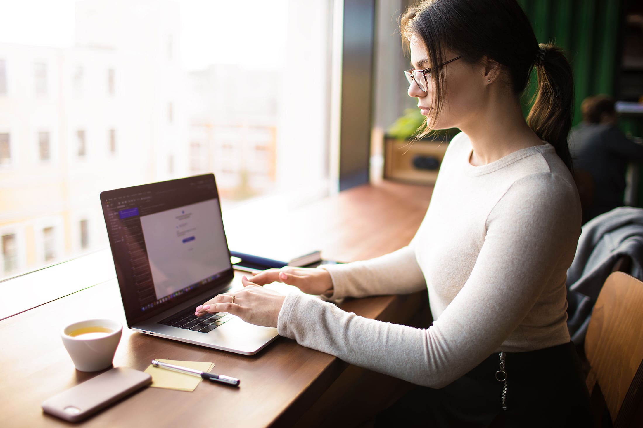 Social media woman working on content with coffee