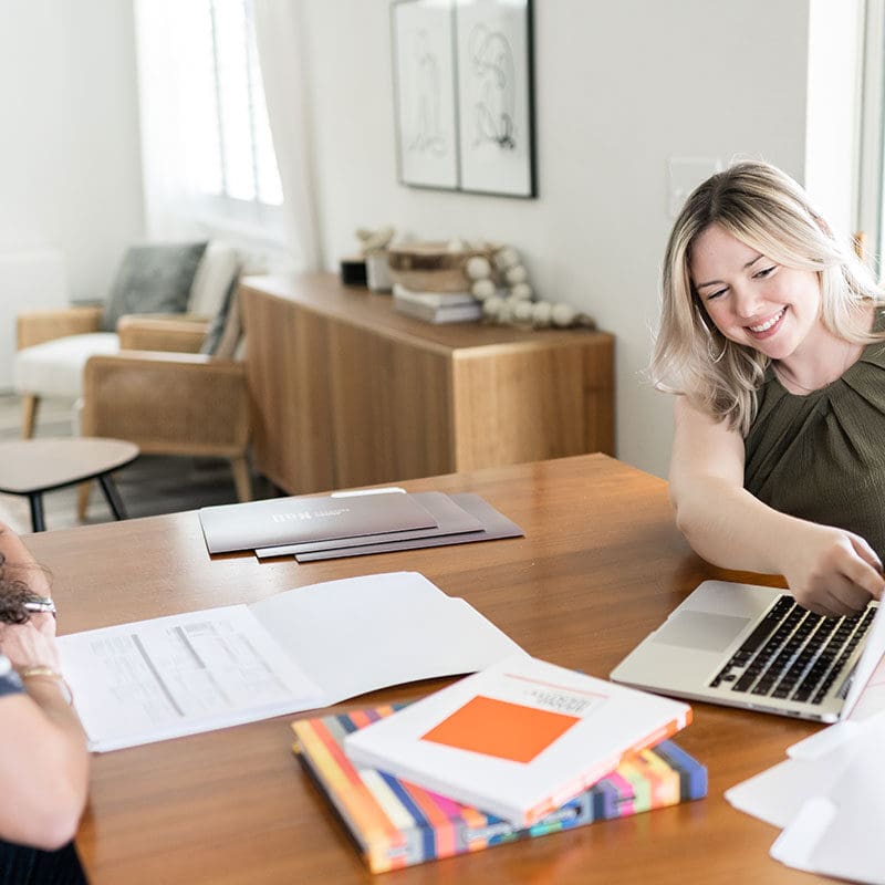 Client discussing SEO results with marketing consultant during an in-person strategy session