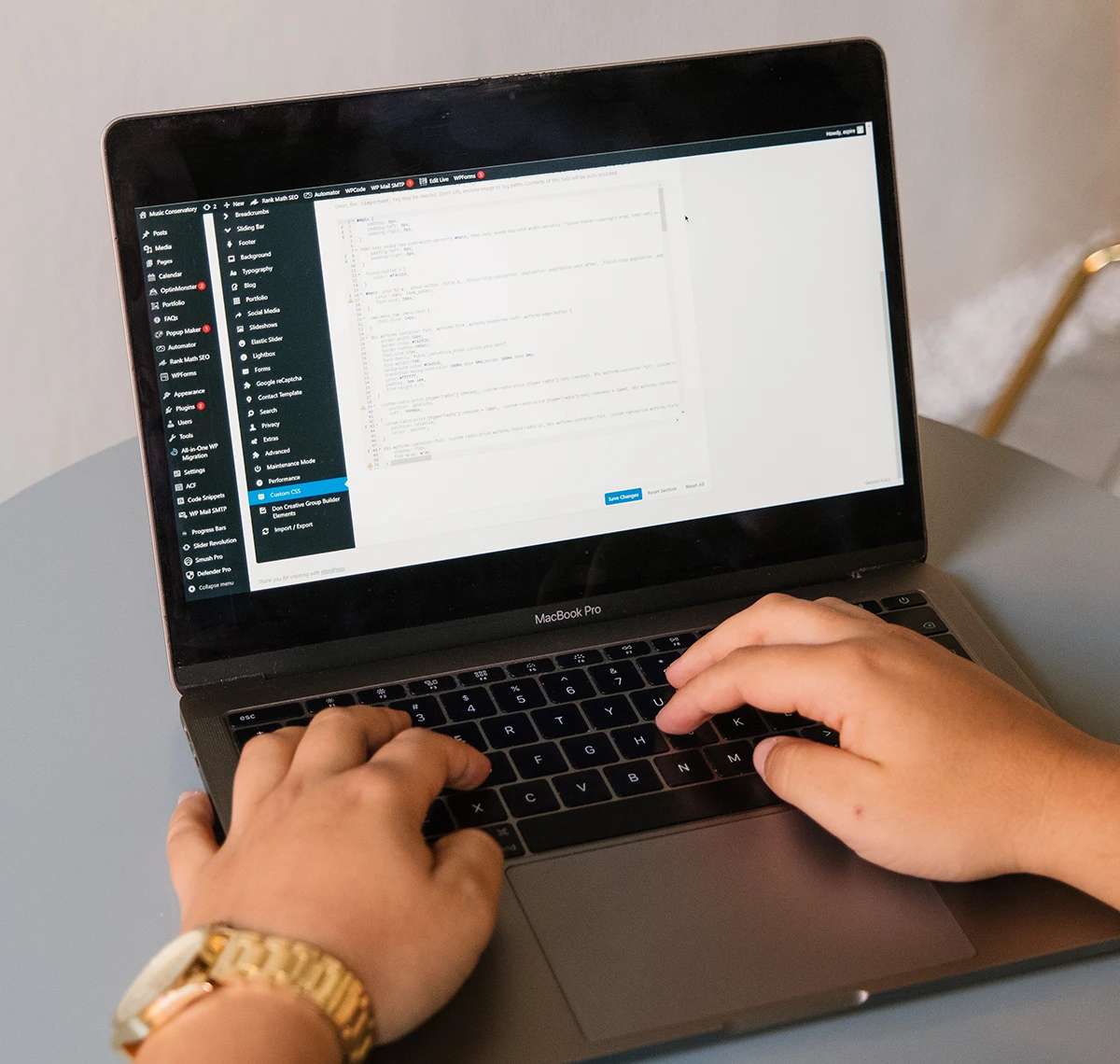 Website maintenance and updates in progress on a laptop, supporting logistics web development, construction website design, and technology website design.