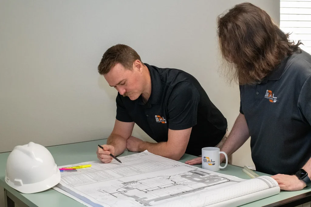 BAL Engineering Construction Plan Review and Engineering Coordination BAL Engineering professionals reviewing construction plans during an internal project planning meeting