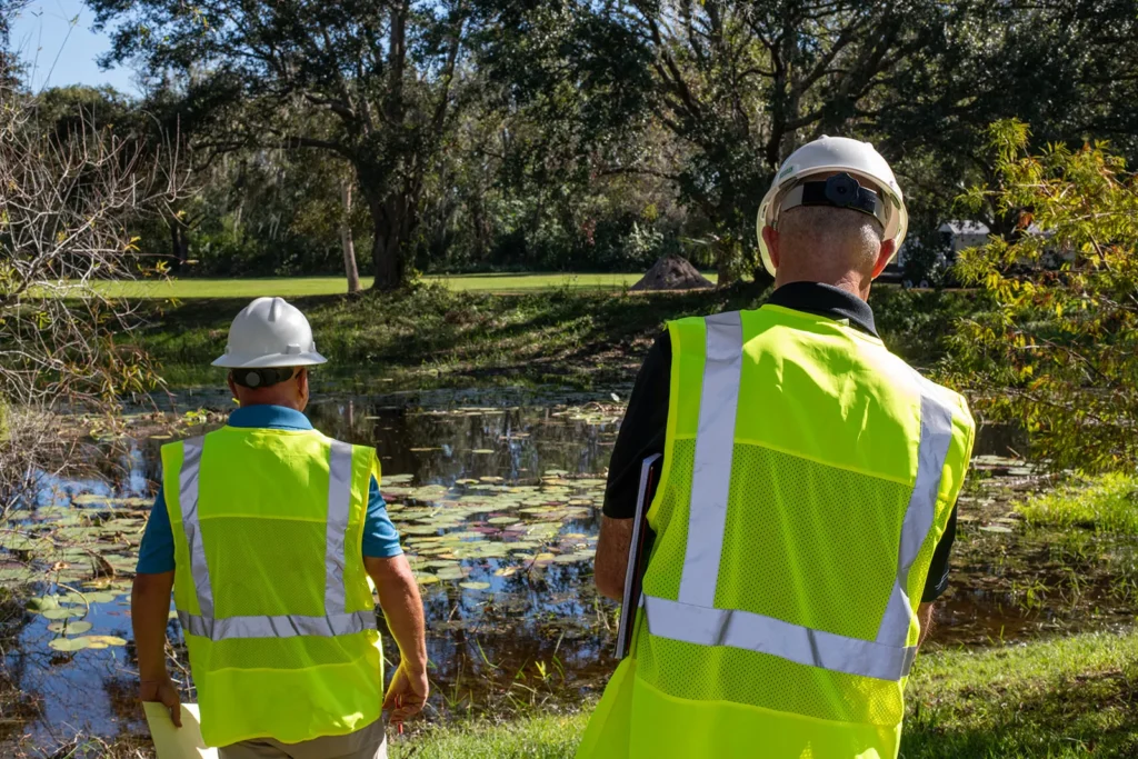 BAL Engineering Environmental Site Assessment and Field Inspection BAL Engineering professionals conducting an on site environmental assessment near a water feature