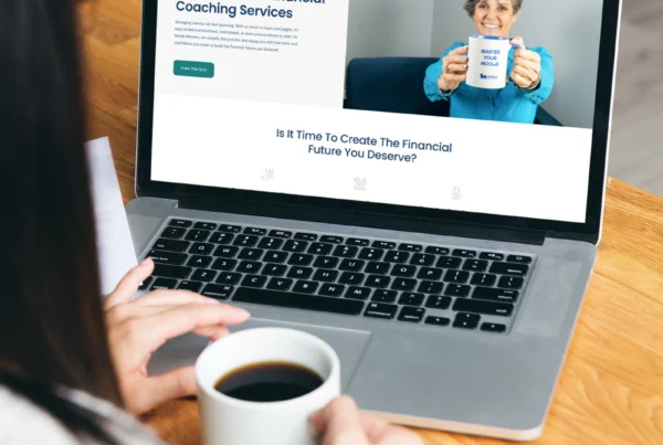 Moola Masters financial coaching website displayed on a laptop during an online learning session