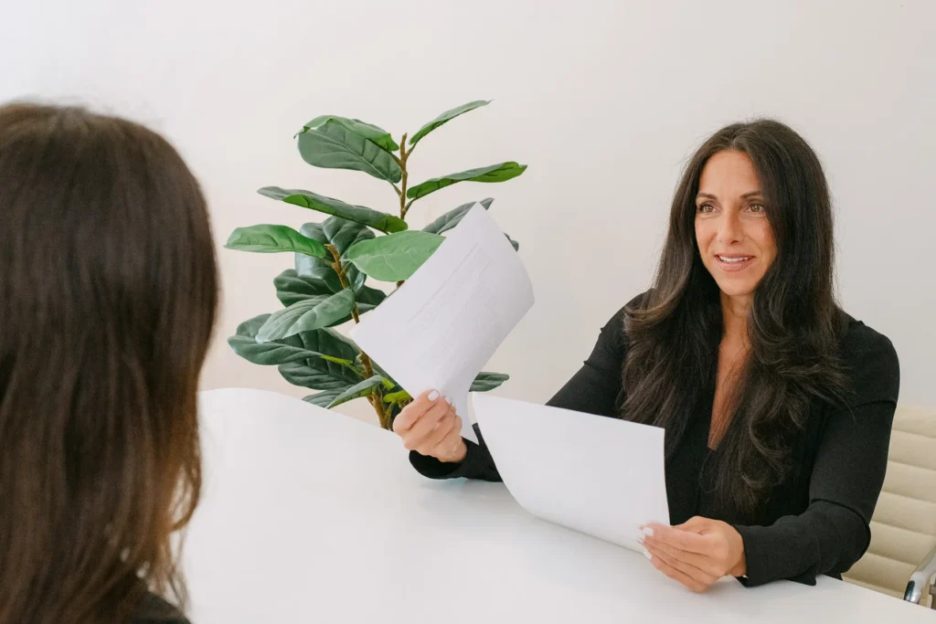 ITAccel executive reviewing documents with candidate during professional staffing consultation