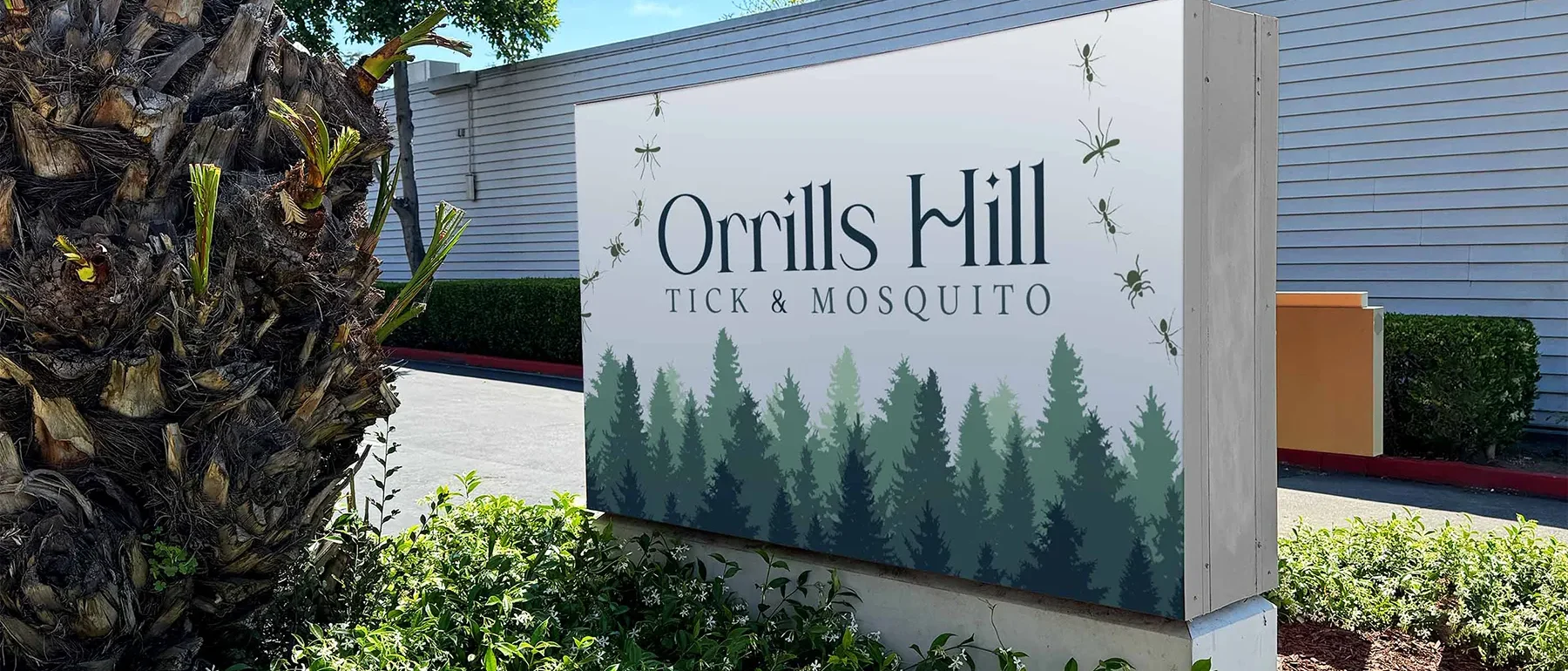 Orrills Hill Tick and Mosquito outdoor sign displayed at a landscaped commercial property