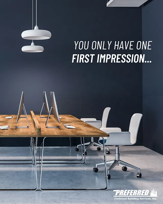 Modern office workspace with clean desks, chairs, and computers, featuring a message that reads “You only have one first impression,” emphasizing the importance of a professional, well-maintained environment