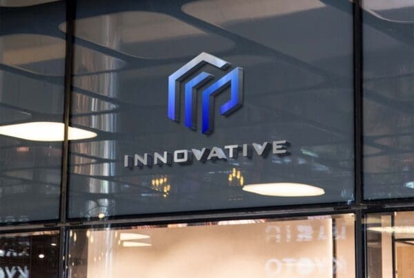 Innovative Homes logo displayed on glass office wall in modern commercial interior
