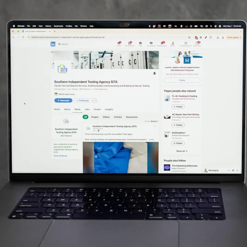 Laptop displaying a LinkedIn company page and post analytics, representing social media updates, content strategy planning, and professional platform engagement